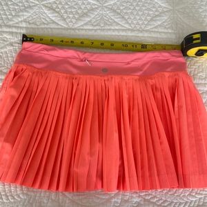 Lululemon sz 8 Pleat to Streat athletic skirt. Coral/peach color
